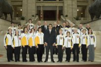 Mnister Robinson congratulates Manitoba curlers