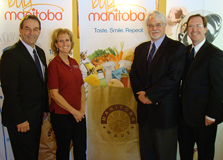 Premier Greg Selinger (second from right) joins Craig Evans (right), Chief Executive Officer, Granny’s Poultry; Scott Chollak, Vice President Retail, Safeway; and Agriculture, Food and Rural Initiatives Minister Ron Kostyshyn (left) at the official launch of the Buy Manitoba campaign at the Safeway store on Henderson Highway.