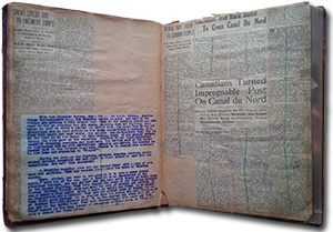 scrap book open to a page with many newspaper articles. headlines include: “Great Credit Due to Engineer Corps” “Reveal Part Truth to German People” “Canadians Had Hard Battle to Cross Canal Du Nord” “Canadians Turned Impregnable Post On Canal du Nord”