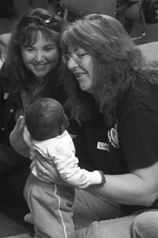 Two women with young child