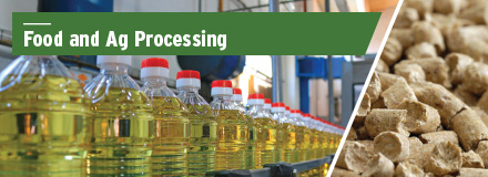upper left Food and Ag Processing green banner across bottled oil assembly line; exruded product to left