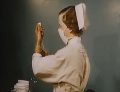 a nurse prepares a needle