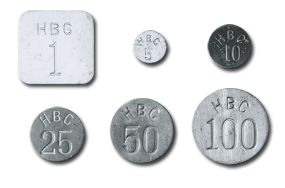 photo of 6 Arctic aluminum tokens in different dominations and sizes