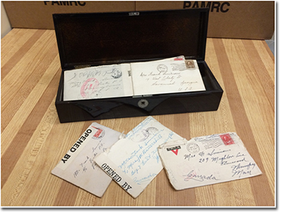 Collection of Battershill family records recently donated to the Archives of Manitoba open box containing letters