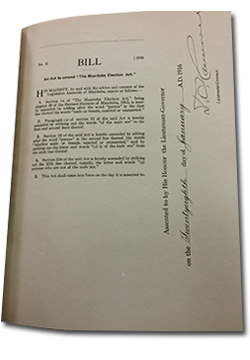 Photo of a page in Bill No. 4 showing An act to ammend The Manitoba Election Act. “Assented to by His Honour the Lieutenant-Governor on the twenty-eighth day of January A.D. 1916.” Signed by the Lieutenant-Governor.