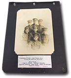 Photograph book is open to show photo of seven men in miliatry uniform (Ross Black, Hugh A. Black, Herbert Francis, Charles Francis, John Black, Thomas W. Laidlaw, Colin F. Black)