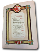 A page in the autograph book with a list of signatures of officers in the 250 overseas battalion 1917. The page has a brightly coloured decorative border with flourishes in the corners.