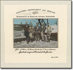 Photo of four men standing in front of an airplane, with the caption: Manitoba Government Air Service Department of Mines and Natural Resources. Pilots J.C. Uhlman, L.H. Phinney , M.B. Barclay, C.T. Travers & M. Kennedy. Staff of original Provincial Air Service. May 25, 1932.