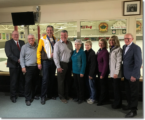 Premier Brian Pallister and Minister of Sport, Culture and Heritage Cathy Coxpose with members of the International Curling Centre of Excellence committee.