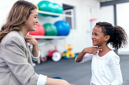 Therapist working with child