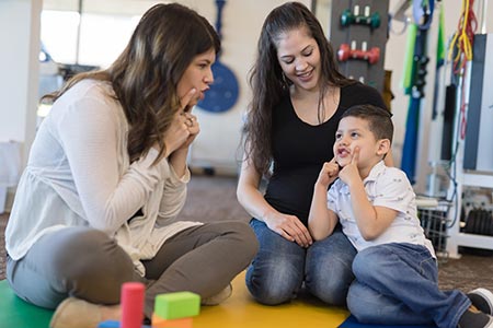 Therapist working with child