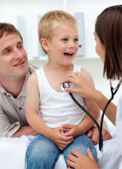doctor holding a stethoscopy on a boy's chest