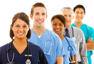five people lined up with stethoscopes around their neck smiling at the camera