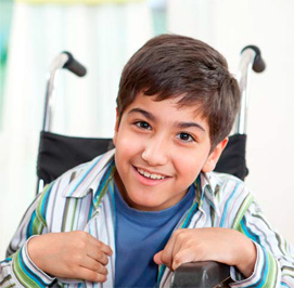 boy in a wheelchair smiling