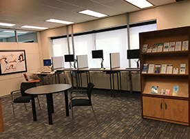 waiting area showing chairs and computer stations