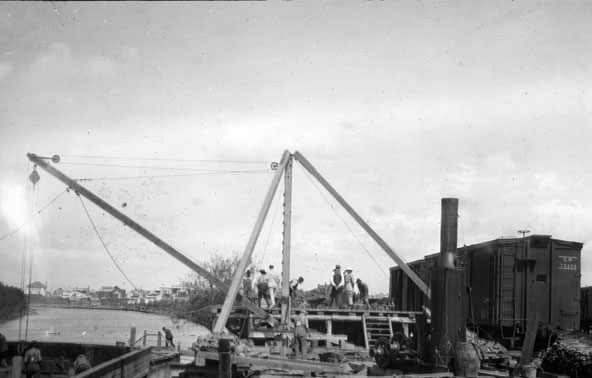 Transfer of Mandy Mine ore from barge to railroad, The Pas.