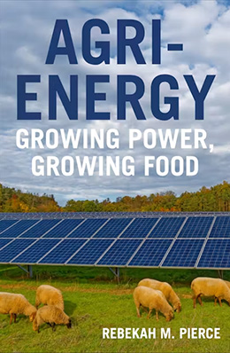 Book cover for Agri-Energy: Growing Power, Growing Food. A field of sheep grazing on green grass stretches across the foreground, with rows of blue solar panels installed behind them. A cloudy sky and autumn-colored trees form the background.