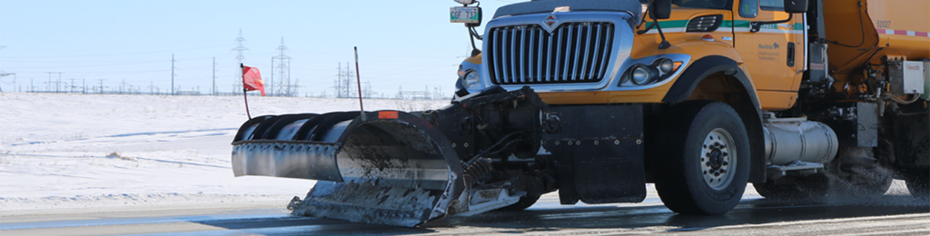 Snowplow cleaning highway