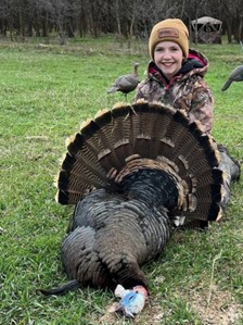 Kid holding a wild turkey Kid holding a wild turkey