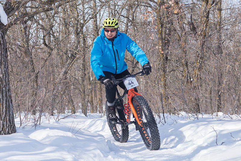 man ride fat tire bike in the show