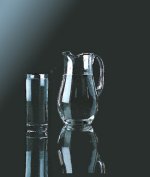 Pitcher of water with tall tumbler of water