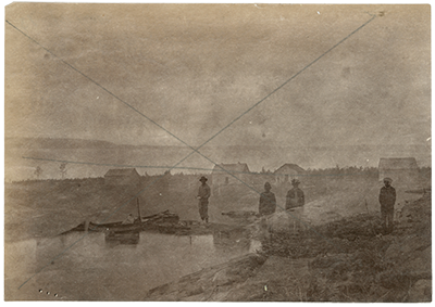 Archives of Manitoba, Hudson’s Bay Company Archives, James McDougall fonds, 1987/13/13, Unnamed, no date [double exposure, one of post, one of four men and loaded canoe], ca. 1889, H4-197-4-1