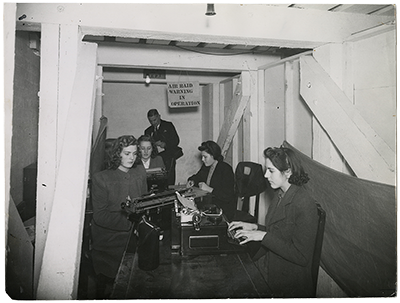 HBC employees in the air raid shelter located in the sub-basement of Beaver House